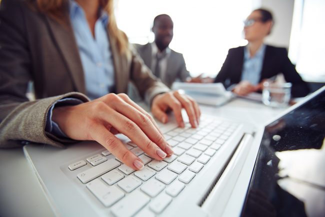 Typing on laptop